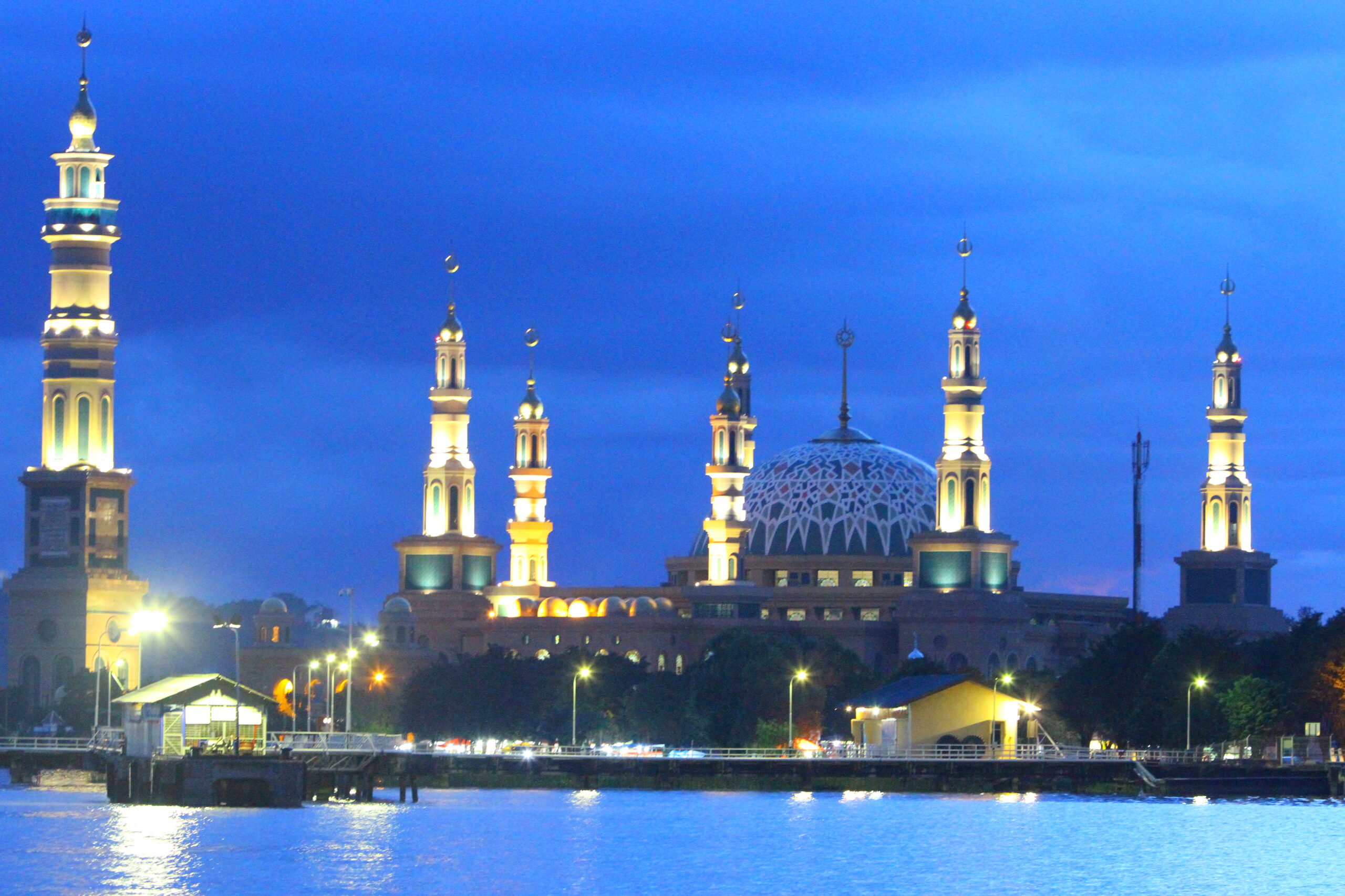 Big mosque in a riverside at dusk